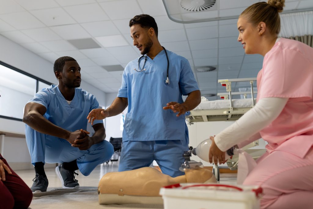 High school graduates learning patient-care skills during CNA training